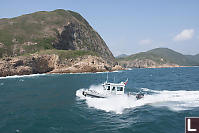 Fisheries Boat Crashing Through The Waves