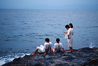 Sitting On Rock Overlooking Ocean