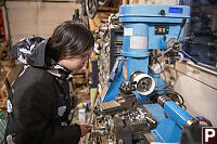 Claira Training To Use Lathe