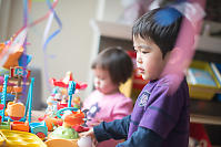 Benjamin Playing With Toys