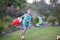 Marcus Running With Balloons