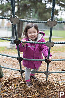 Nara Playing On Rope Net