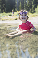 Claira Sitting In Shallow Water