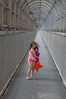 Kids Keeping Warm On Fraser River Bridge Walkway